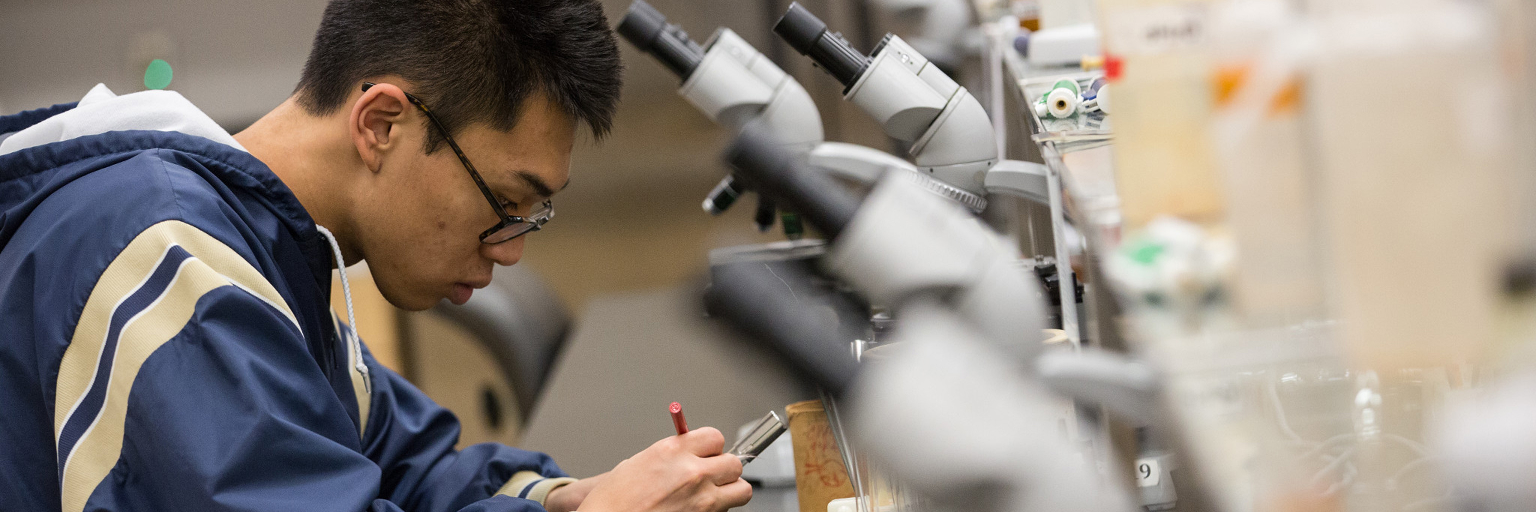 Boy with microscope